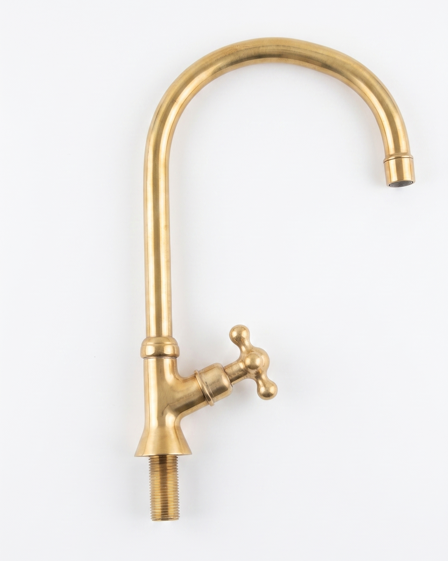 Unlacquered Brass Bridge Faucet  With a Side Sprayer and a Separate Cold Water Faucet.