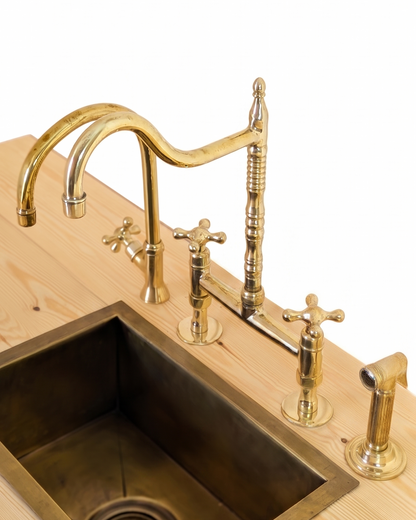 Unlacquered Brass Bridge Faucet  With a Side Sprayer and a Separate Cold Water Faucet.