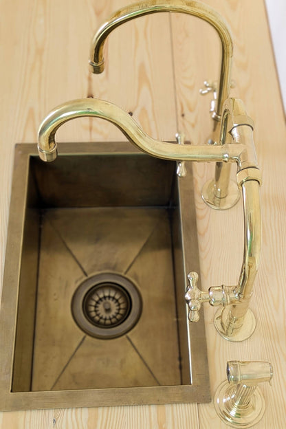 Unlacquered Brass Bridge Kitchen Set With A Side Sprayer And Cold Water Faucet.