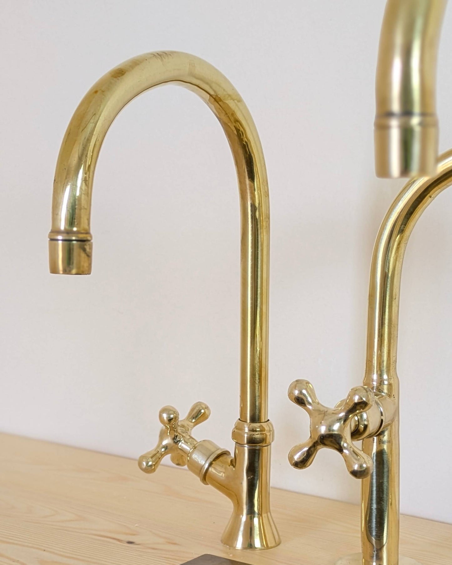 Unlacquered Brass Bridge Kitchen Set With A Side Sprayer And Cold Water Faucet.