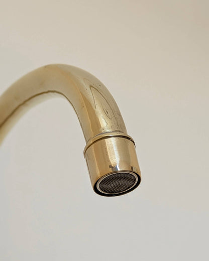 Unlacquered Brass Bridge Faucet  With a Side Sprayer and a Separate Cold Water Faucet.