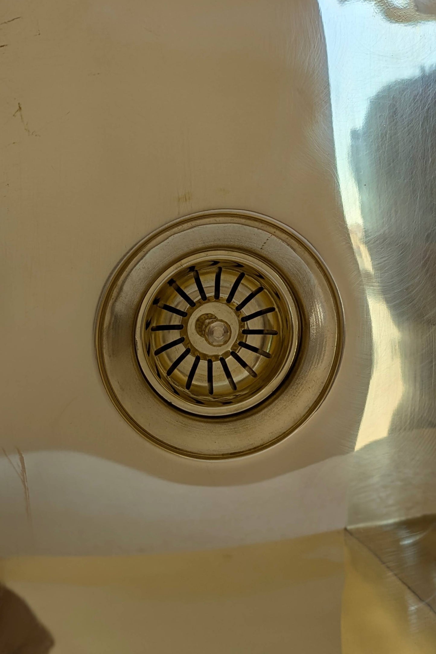 Undermount Single Bowl brass Sink: Rectangular Unlacquered Sink With It Drain Basket.