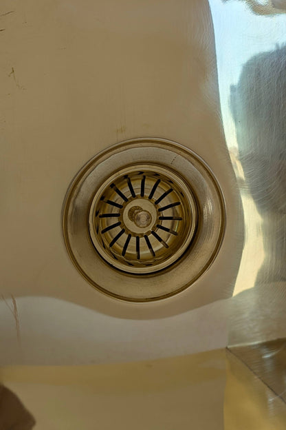 Undermount Single Bowl brass Sink: Rectangular Unlacquered Sink With It Drain Basket.