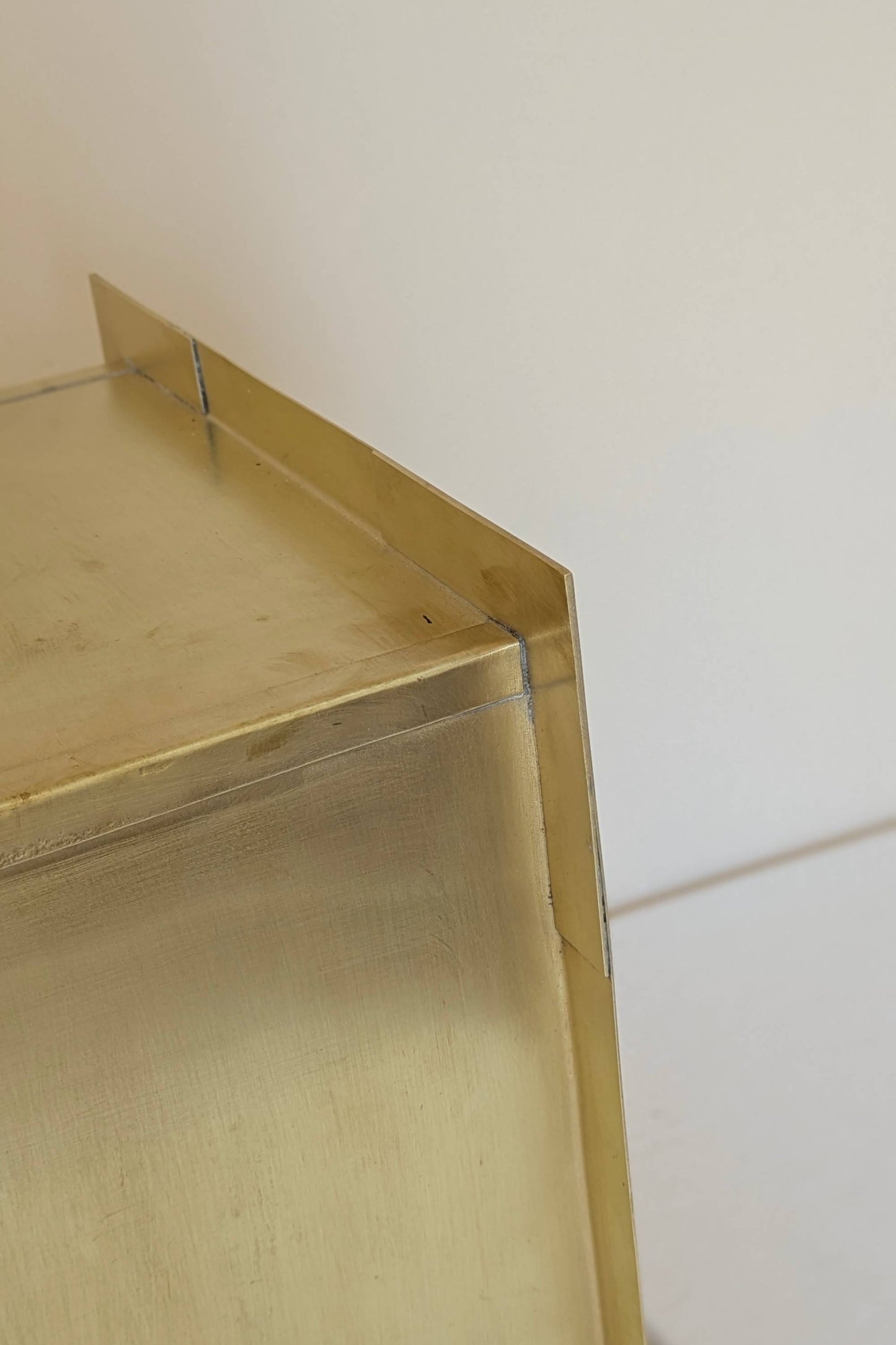 Undermount Single Bowl brass Sink: Rectangular Unlacquered Sink With It Drain Basket.