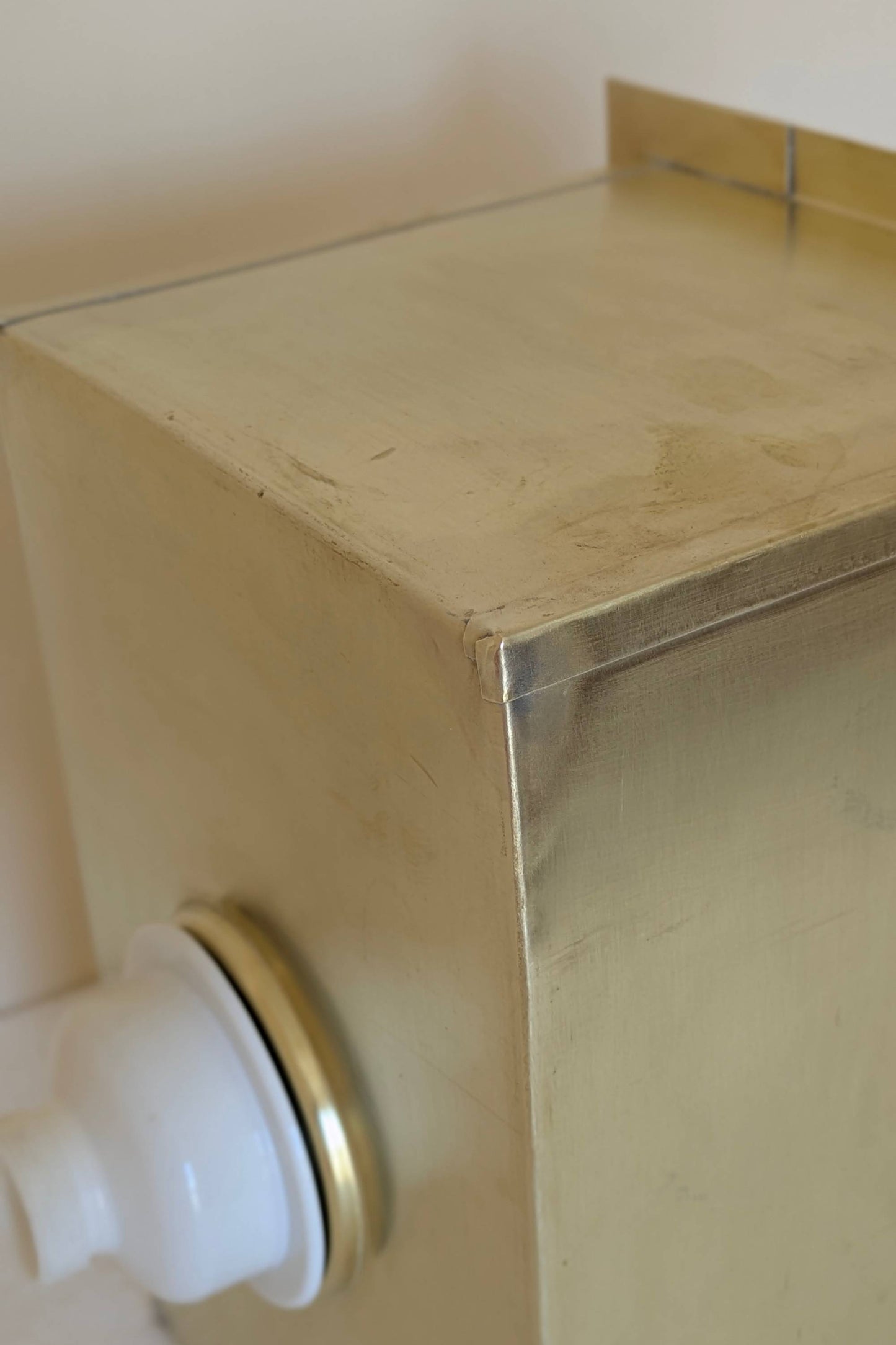 Undermount Single Bowl brass Sink: Rectangular Unlacquered Sink With It Drain Basket.