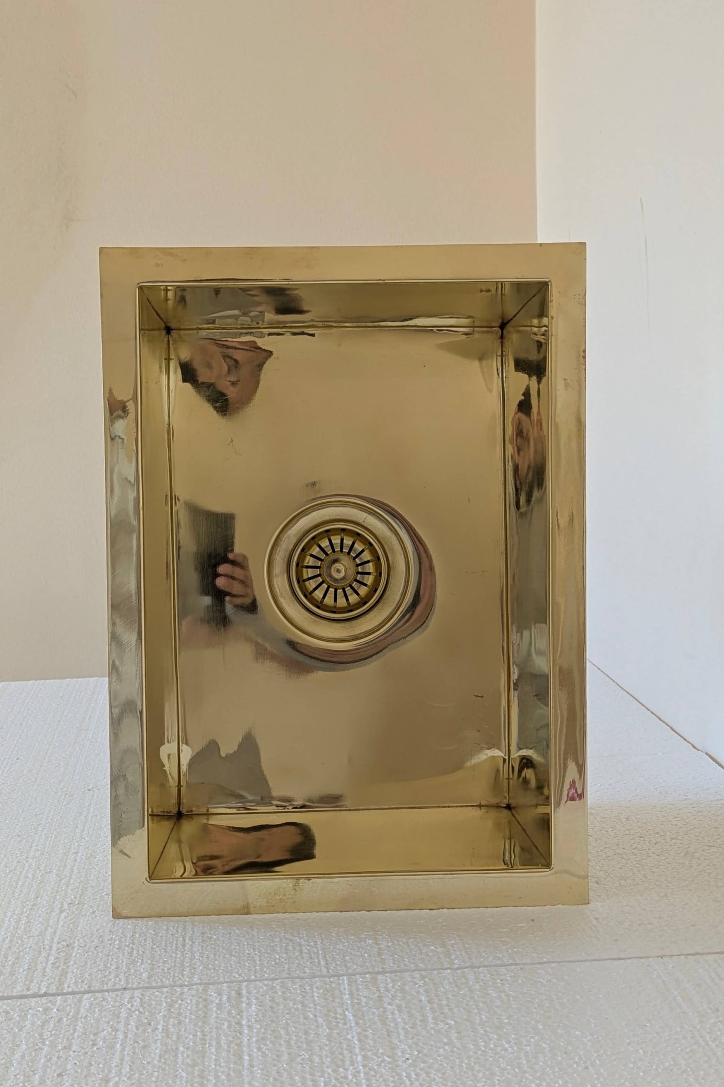 Undermount Single Bowl brass Sink: Rectangular Unlacquered Sink With It Drain Basket.