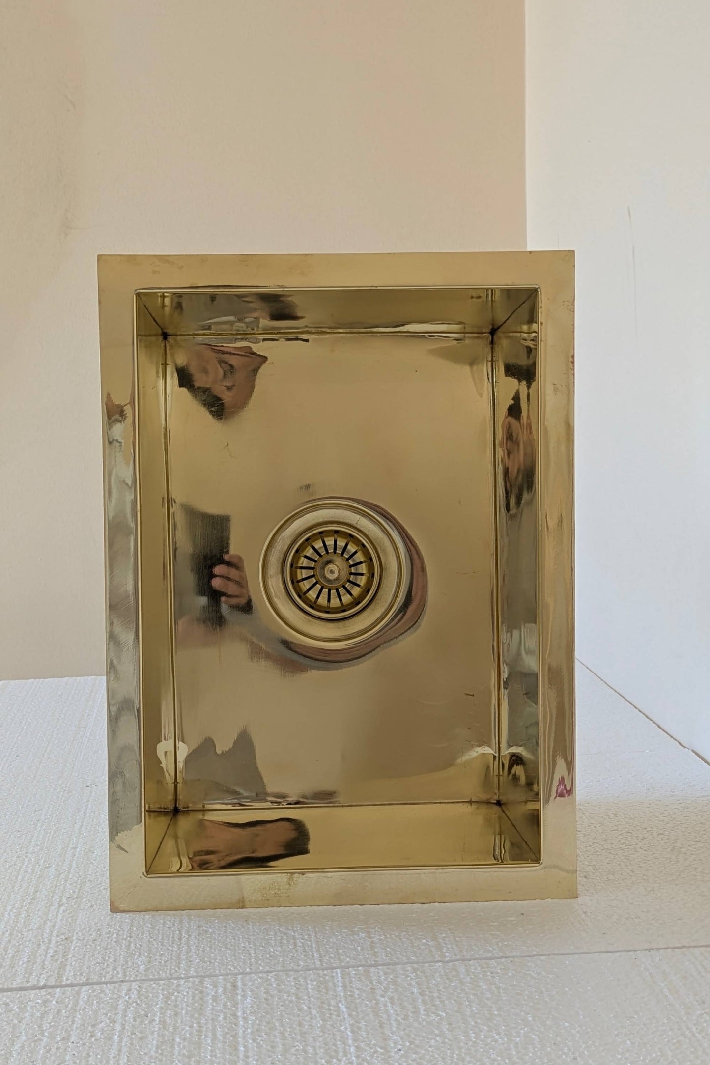 Undermount Single Bowl brass Sink: Rectangular Unlacquered Sink With It Drain Basket.