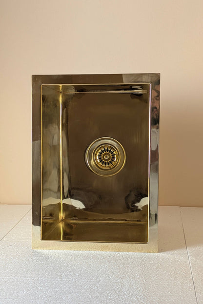 Undermount Single Bowl brass Sink: Rectangular Unlacquered Sink With It Drain Basket.