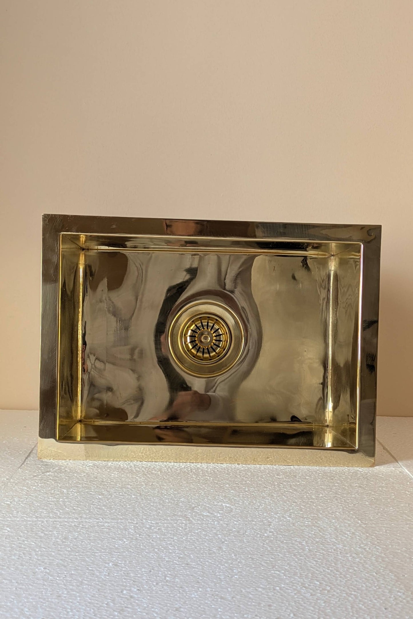 Undermount Single Bowl brass Sink: Rectangular Unlacquered Sink With It Drain Basket.